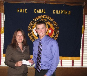 In June, Jean Haga (l), Syracuse Research Corporation, presents a $2,500 scholarship award to Kevin Burr, a student at the State University of New York Institute of Technology, in recognition of his outstanding academic achievements.